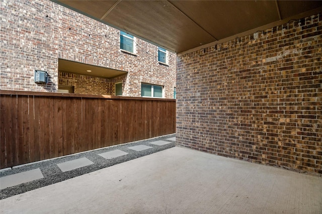 view of patio featuring fence