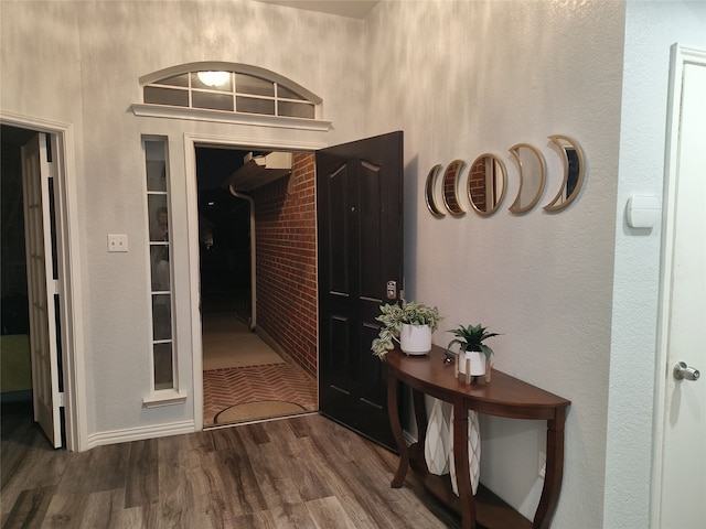 corridor featuring wood finished floors