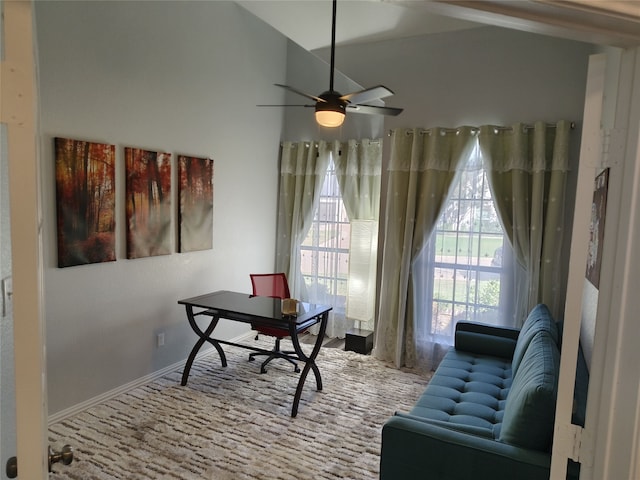 office area with ceiling fan and baseboards