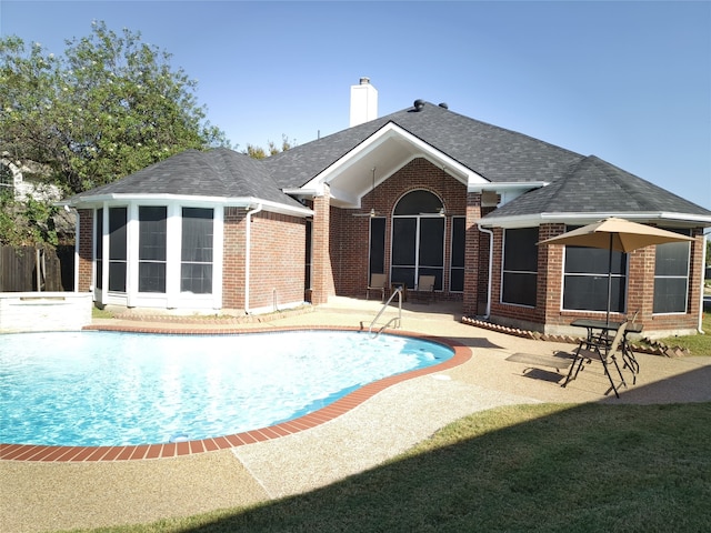 view of pool with a fenced in pool and a patio