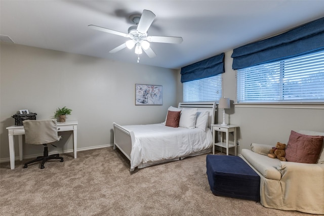 bedroom with ceiling fan, carpet flooring, and baseboards