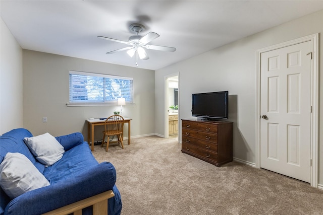 living area featuring carpet floors, a ceiling fan, and baseboards