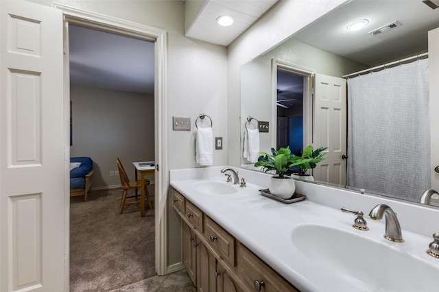 full bath with double vanity, a sink, visible vents, and tile patterned floors