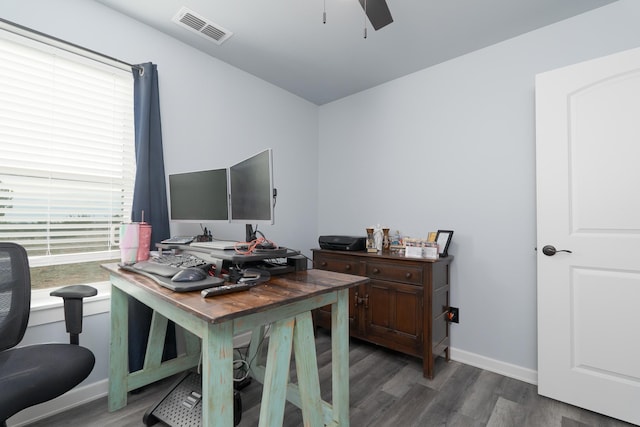 office space with a ceiling fan, baseboards, visible vents, and wood finished floors