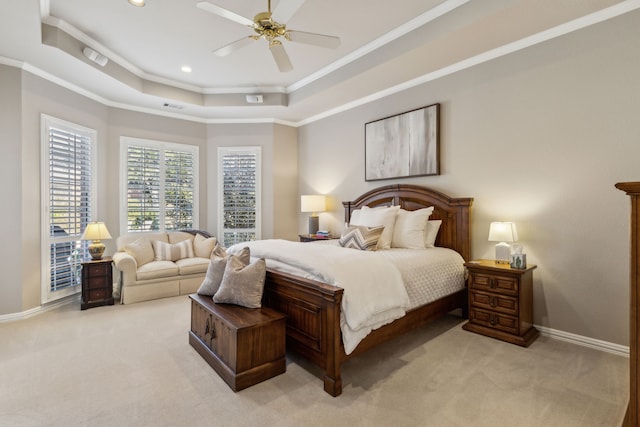 bedroom featuring light carpet, baseboards, visible vents, a tray ceiling, and crown molding