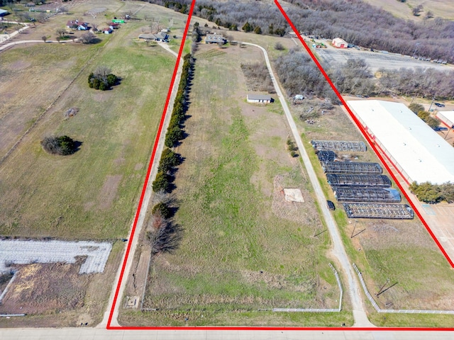 birds eye view of property featuring a rural view