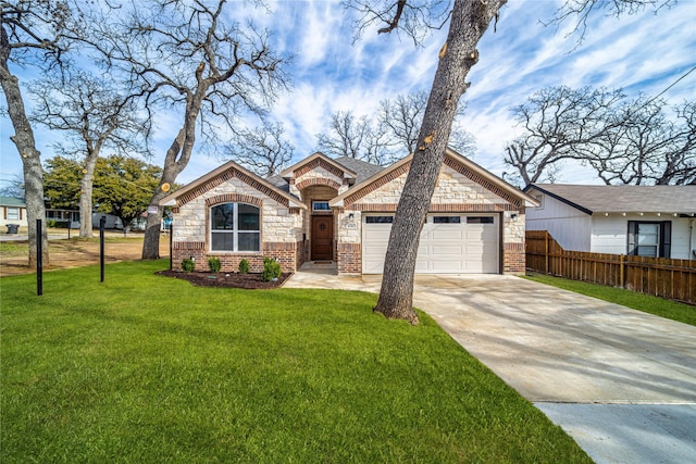 view of front facade featuring brick siding, concrete driveway, fence, stone siding, and a front lawn