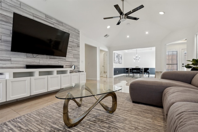 living area featuring lofted ceiling, recessed lighting, visible vents, and ceiling fan with notable chandelier