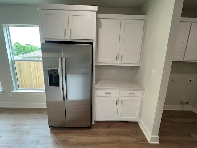 3244 Crites St, Richland Hills, TX 76118 - kitchen with stainless steel fridge with ice dispenser, backsplash, white cabinets, light countertops, and light wood-style floors