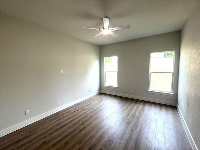3244 Crites St, Richland Hills, TX 76118 - empty room featuring a ceiling fan, dark wood-style floors, and baseboards