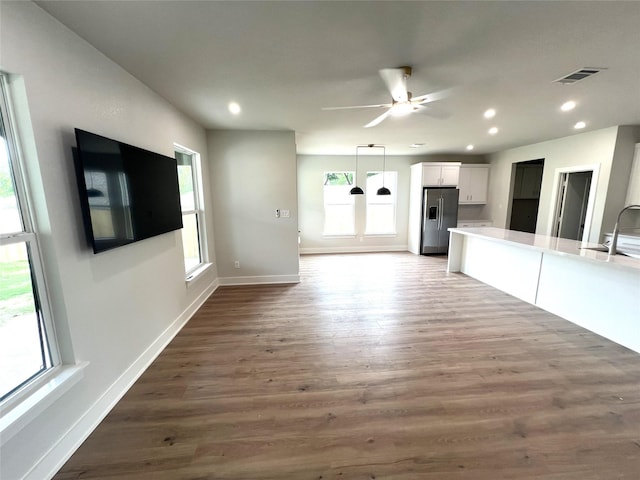 3244 Crites St, Richland Hills, TX 76118 - unfurnished living room with wood finished floors, a sink, baseboards, recessed lighting, and a ceiling fan