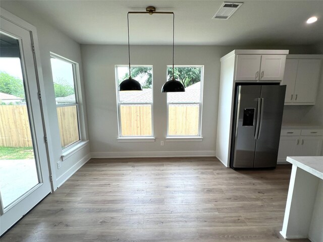 3244 Crites St, Richland Hills, TX 76118 - unfurnished dining area with baseboards, light wood-style flooring, and recessed lighting