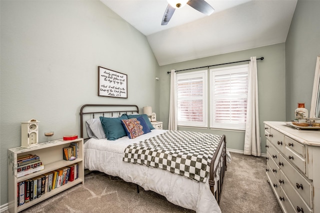 bedroom with a ceiling fan, carpet, vaulted ceiling, and baseboards