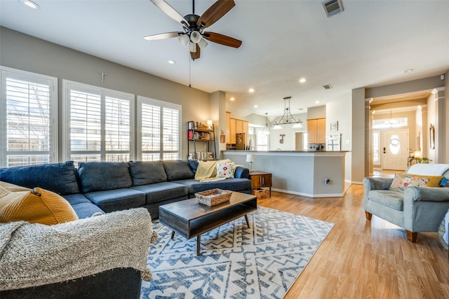 living area featuring recessed lighting, visible vents, ceiling fan, light wood-type flooring, and baseboards