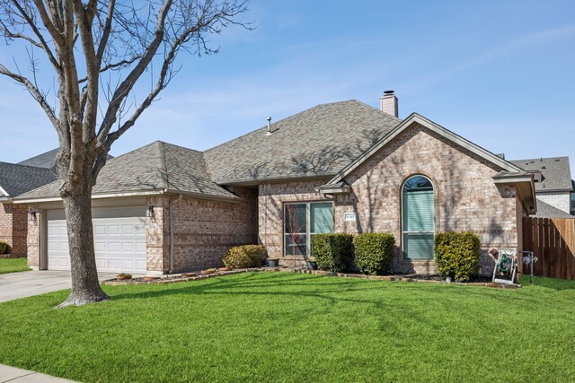 view of front facade featuring brick siding, a garage, a chimney, roof with shingles, and driveway