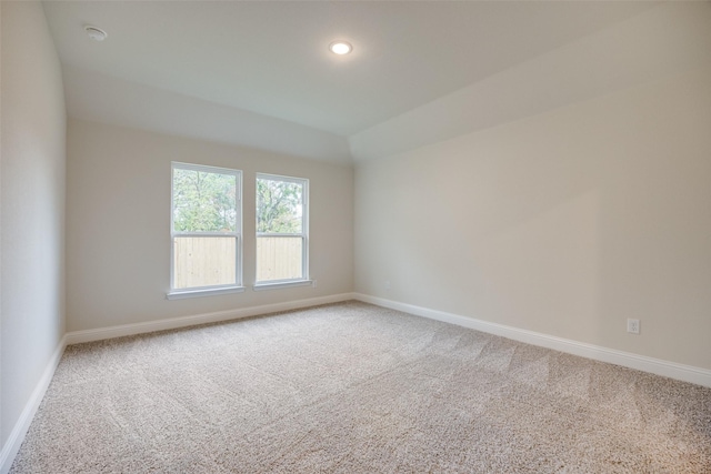 414 Water St, Whitesboro, TX 76273 - carpeted spare room featuring baseboards, recessed lighting, vaulted ceiling, and a smoke detector