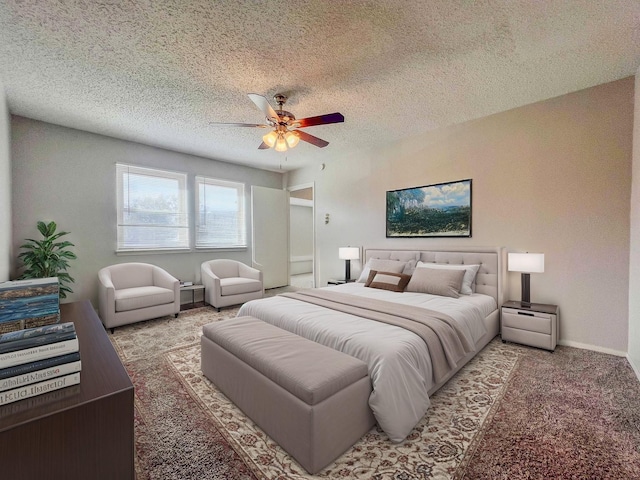 bedroom featuring baseboards, a textured ceiling, a ceiling fan, and carpet flooring