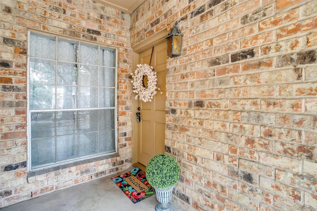 property entrance with brick siding