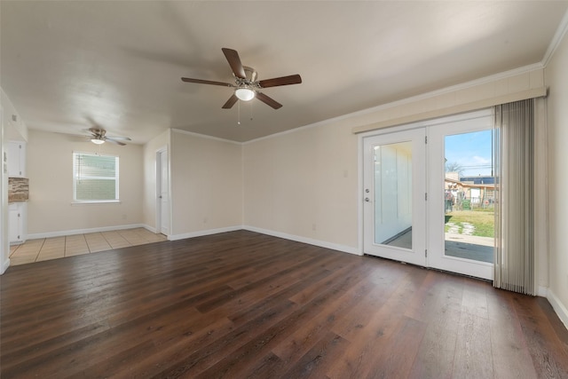 unfurnished living room with ornamental molding, a healthy amount of sunlight, and wood finished floors