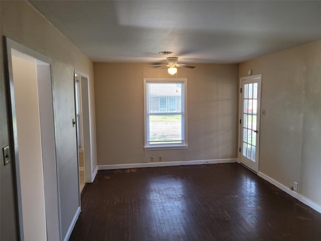 empty room with wood-type flooring, baseboards, and ceiling fan