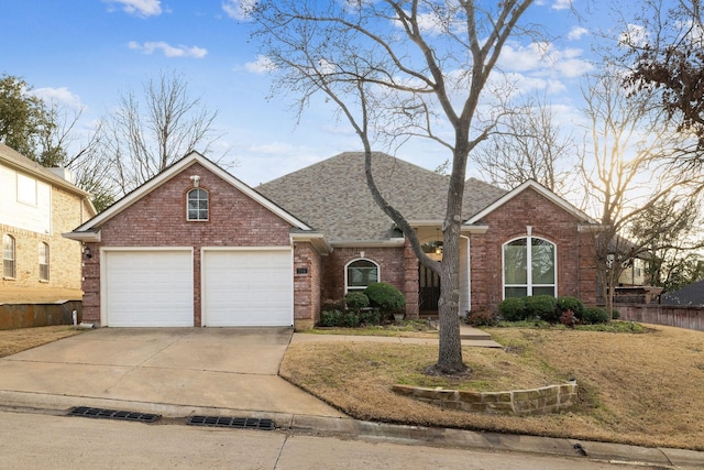 single story home with an attached garage, brick siding, a shingled roof, fence, and driveway