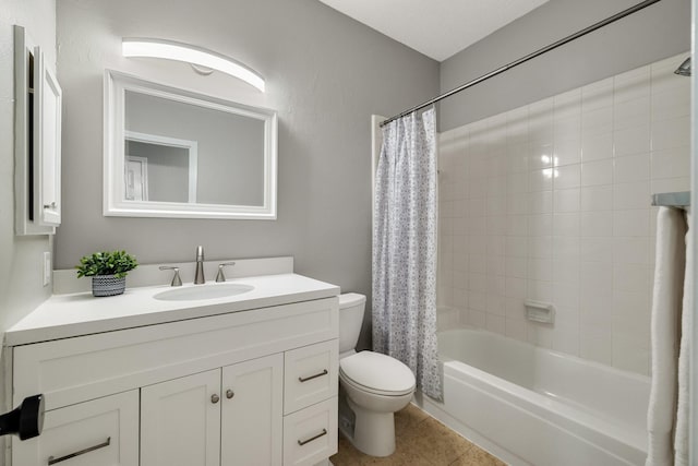 bathroom featuring toilet, tile patterned floors, shower / bath combo, and vanity