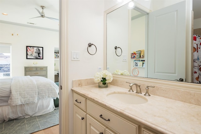 bathroom with visible vents, ensuite bath, vanity, and a ceiling fan