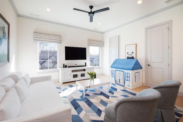 living room with recessed lighting, visible vents, and crown molding