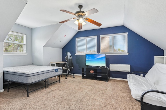 carpeted bedroom featuring lofted ceiling, a textured ceiling, baseboards, and a ceiling fan