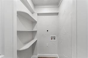 laundry room featuring laundry area, baseboards, wood finished floors, washer hookup, and electric dryer hookup
