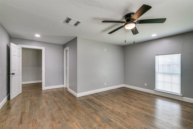 unfurnished room with baseboards, visible vents, wood finished floors, and recessed lighting