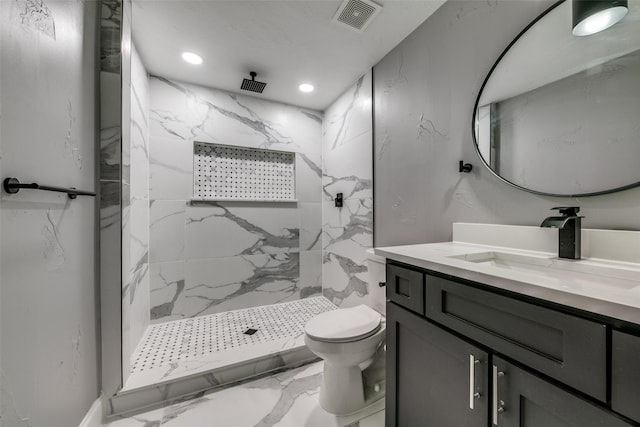 full bath featuring toilet, a marble finish shower, vanity, and visible vents