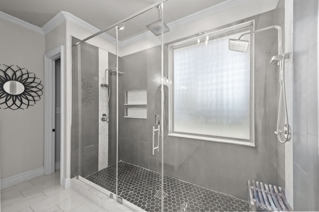 bathroom with baseboards, a stall shower, and crown molding