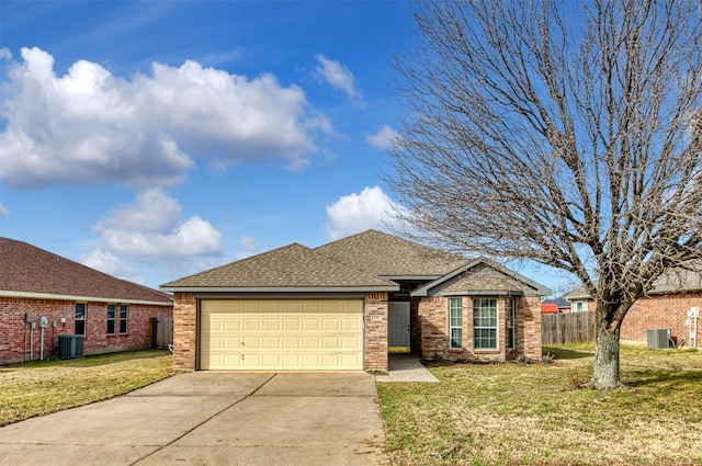 view of front facade featuring driveway, an attached garage, cooling unit, and a front yard