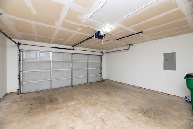 garage featuring electric panel and a garage door opener