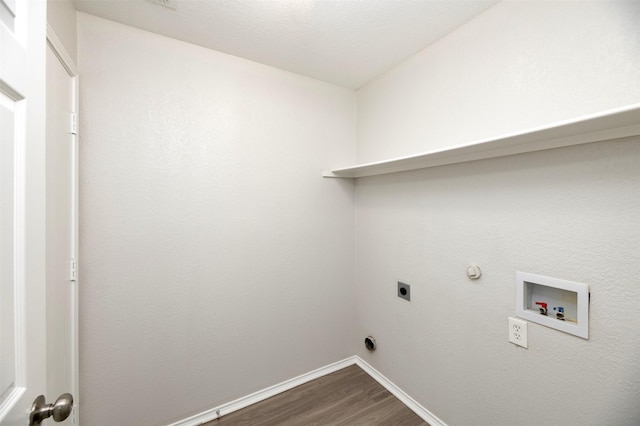 washroom with dark wood finished floors, hookup for a washing machine, electric dryer hookup, laundry area, and baseboards