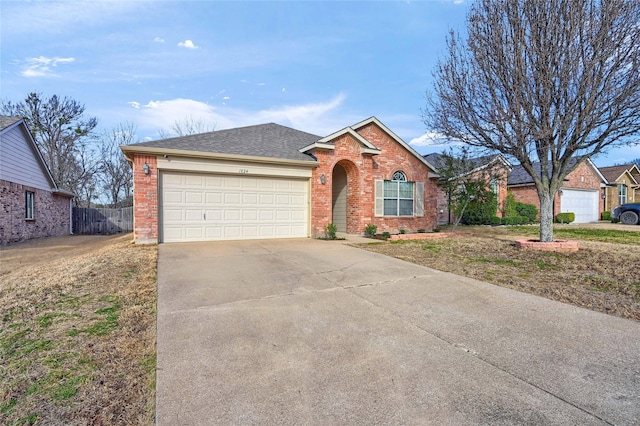 ranch-style home featuring driveway, a shingled roof, an attached garage, fence, and brick siding