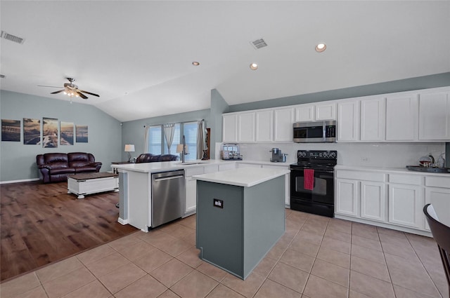 kitchen featuring stainless steel appliances, open floor plan, visible vents, and light tile patterned floors