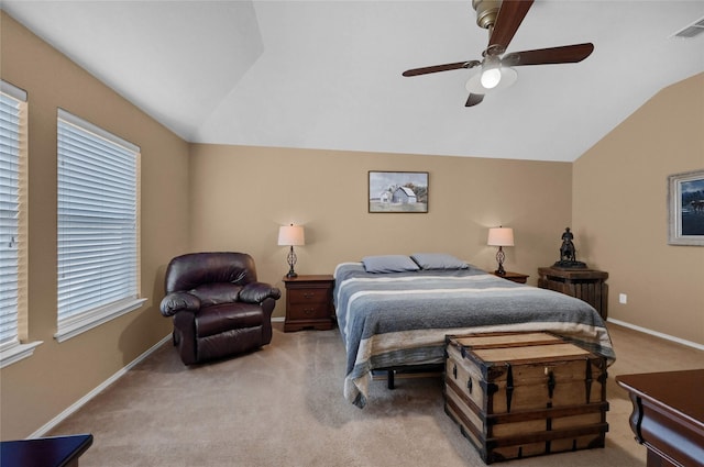 carpeted bedroom with lofted ceiling, visible vents, ceiling fan, and baseboards