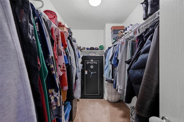 walk in closet featuring carpet floors