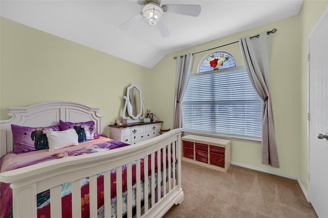 bedroom featuring vaulted ceiling, ceiling fan, carpet flooring, and baseboards