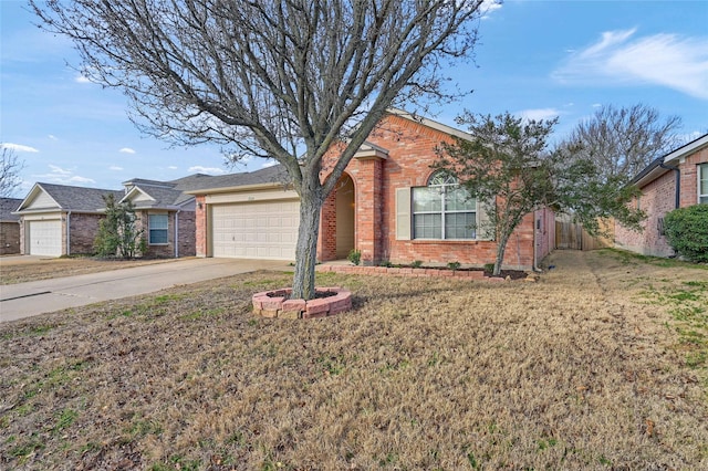 ranch-style home with a garage, a front yard, brick siding, and driveway