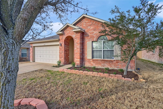 view of front facade featuring concrete driveway, brick siding, and an attached garage