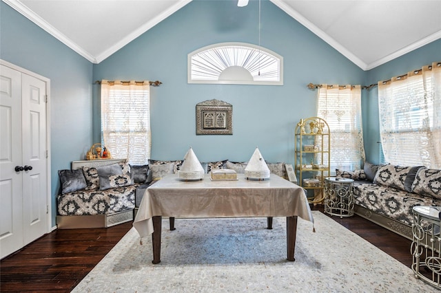 interior space featuring vaulted ceiling, wood finished floors, and crown molding