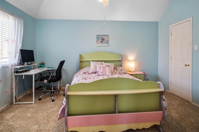 carpeted bedroom with lofted ceiling