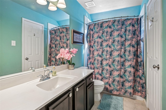 bathroom featuring visible vents, a shower with shower curtain, toilet, tile patterned floors, and vanity