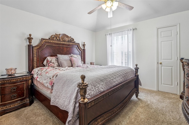 bedroom featuring lofted ceiling, carpet floors, and ceiling fan