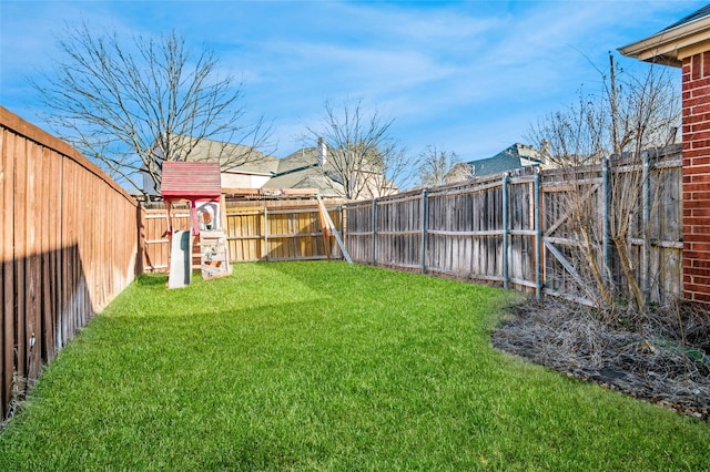 view of yard with a fenced backyard