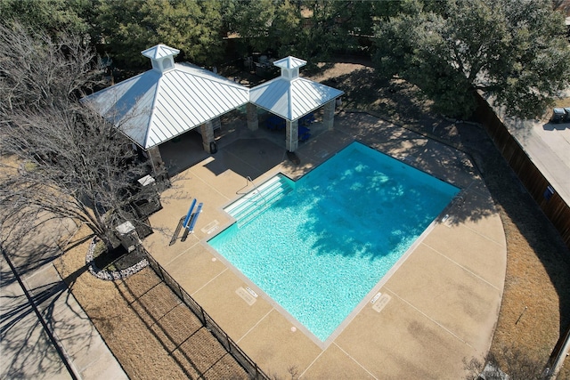 view of pool featuring a fenced backyard, a fenced in pool, a patio, and a gazebo