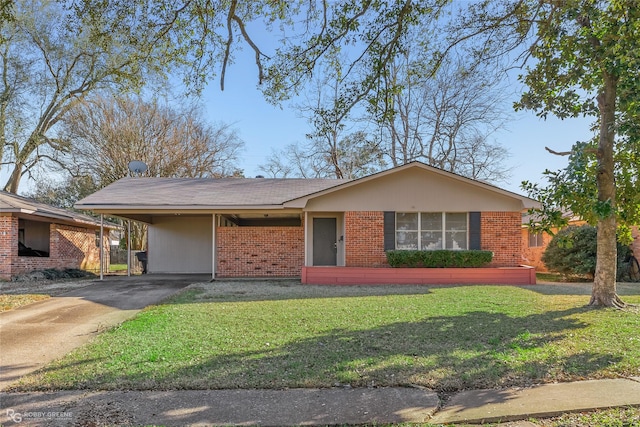 single story home featuring an attached carport, brick siding, driveway, and a front lawn